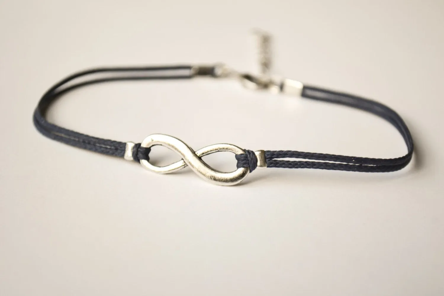 Dainty blue cord anklet with silver infinity charm, gift wrapped