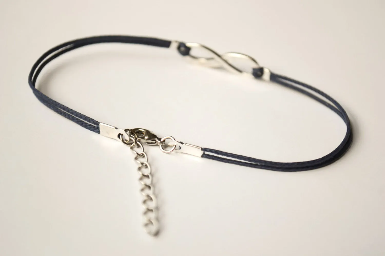 Dainty blue cord anklet with silver infinity charm, gift wrapped