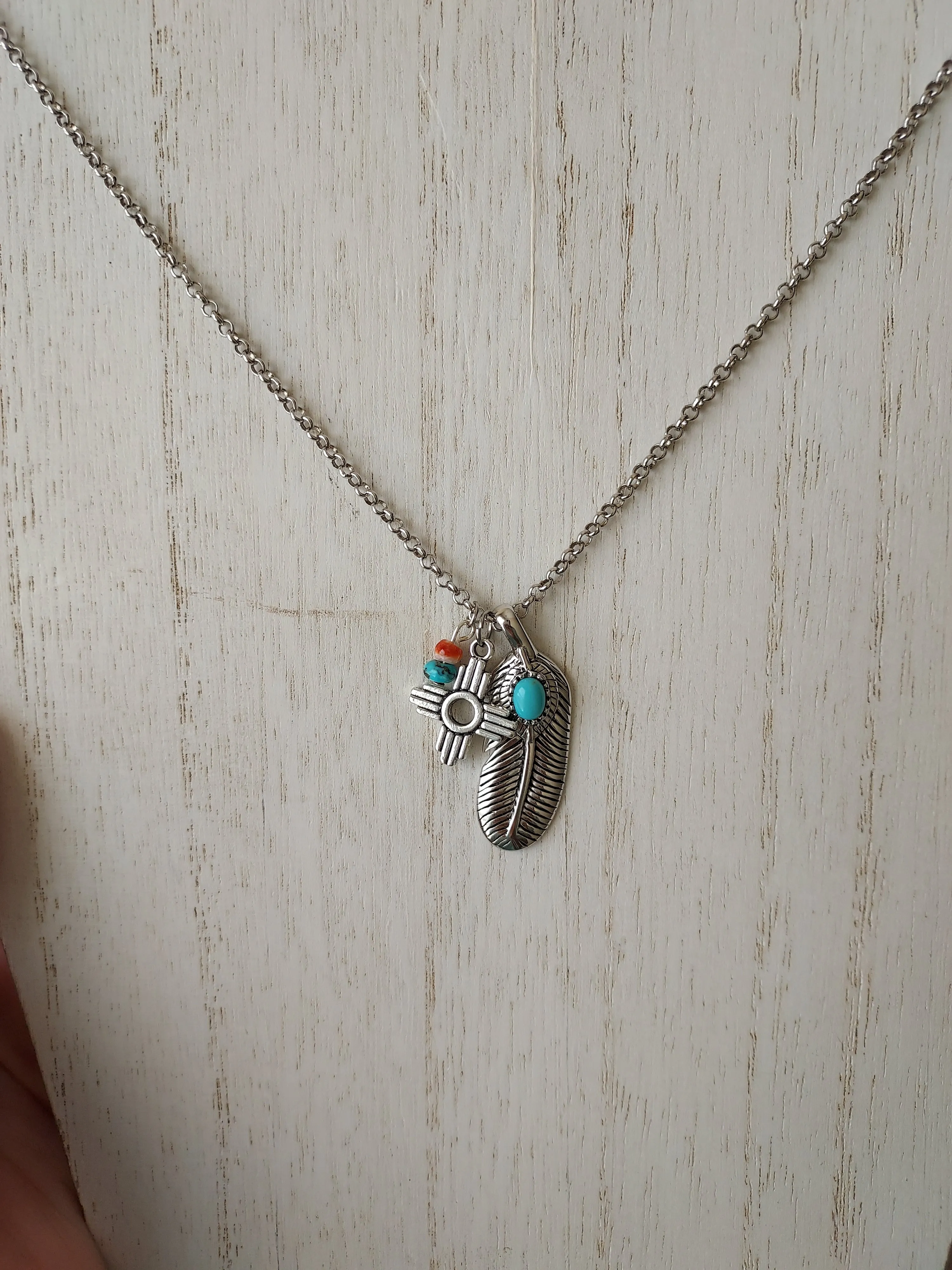 Feather in her halo charmed necklace